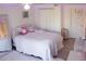 Bright bedroom with a plush white bed and modern decor, creating a cozy and stylish retreat within the home at 420 N 5Th St, Lake Wales, FL 33853
