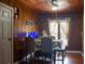Charming dining area with hardwood floors and wood paneled walls, creating a cozy and inviting space for meals at 420 N 5Th St, Lake Wales, FL 33853