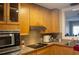 Well-equipped kitchen featuring light wood cabinets and modern appliances, offering a functional and stylish cooking space at 420 N 5Th St, Lake Wales, FL 33853