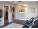 Inviting living room with hardwood floors and an open view of the adjacent kitchen and dining area at 420 N 5Th St, Lake Wales, FL 33853