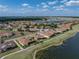 Aerial shot of home in a lake community with golf course and walking path access at 4279 Ashton Club Dr, Lake Wales, FL 33859