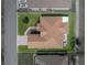 A beautiful aerial view of a single Gathering home with a lawn and a brick paved driveway at 4279 Ashton Club Dr, Lake Wales, FL 33859