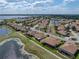 Aerial view of the property in a neighborhood with golf course and walking path access at 4279 Ashton Club Dr, Lake Wales, FL 33859