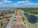 A high aerial view of the property in a neighborhood with a golf course, and lakes nearby at 4279 Ashton Club Dr, Lake Wales, FL 33859