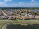 Gorgeous aerial view of the property highlighting the lake, golf course and residential area at 4279 Ashton Club Dr, Lake Wales, FL 33859