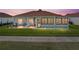 Charming single-story home featuring a brick patio and a cozy screened-in porch at 4279 Ashton Club Dr, Lake Wales, FL 33859