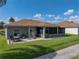 This backyard has an outdoor seating area and relaxing, screened in porch at 4279 Ashton Club Dr, Lake Wales, FL 33859