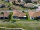 Backyard aerial view of the home, with brick patio and view of lake and community at 4279 Ashton Club Dr, Lake Wales, FL 33859