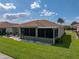 Charming single-story home featuring a brick patio and a cozy screened-in porch at 4279 Ashton Club Dr, Lake Wales, FL 33859