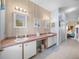 Bright bathroom featuring double sinks, ample counter space, and a tiled floor at 4279 Ashton Club Dr, Lake Wales, FL 33859