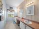 Well-lit bathroom featuring double sinks, ample counter space, and a window at 4279 Ashton Club Dr, Lake Wales, FL 33859