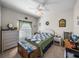 Cozy bedroom with a charming wicker bed frame and coordinated decor at 4279 Ashton Club Dr, Lake Wales, FL 33859