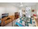 Comfortable bedroom with carpet floors, dressers, display case, and a TV at 4279 Ashton Club Dr, Lake Wales, FL 33859