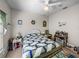 Inviting bedroom featuring a wicker bed, coordinated linens, and ample natural light at 4279 Ashton Club Dr, Lake Wales, FL 33859