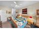 A comfortably furnished bedroom featuring carpet floors, a quilt bed, and warm lamps at 4279 Ashton Club Dr, Lake Wales, FL 33859