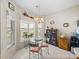 Bright breakfast nook featuring a glass table, natural light, and charming decor at 4279 Ashton Club Dr, Lake Wales, FL 33859