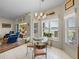 Cozy breakfast nook with a glass table, scenic view, and convenient access to the living room at 4279 Ashton Club Dr, Lake Wales, FL 33859
