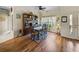 The dining room has hardwood floors, a large bookcase, and a decorative front door at 4279 Ashton Club Dr, Lake Wales, FL 33859