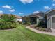 Charming single-story home with a well-maintained lawn, brick walkway, and inviting curb appeal at 4279 Ashton Club Dr, Lake Wales, FL 33859