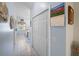 Hallway with tile floors that provides access to other rooms and includes closet space at 4279 Ashton Club Dr, Lake Wales, FL 33859