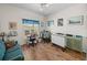 Bright home office with hardwood floors, a work area, and comfortable seating at 4279 Ashton Club Dr, Lake Wales, FL 33859