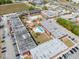 Full aerial shot of the complex featuring parking, pool, and green space at 43420 Highway 27 # 445, Davenport, FL 33837