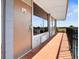 Balcony view showcasing the exterior of a motel room with a door, window, and black iron railing at 43420 Highway 27 # 445, Davenport, FL 33837