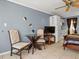 Small open plan living space with a dining table, kitchenette, and bed in a studio layout at 43420 Highway 27 # 445, Davenport, FL 33837