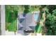 Aerial view featuring a fenced backyard with a screened pool, large yard, manicured lawn, and mature trees at 508 Starr Ridge Dr, Lake Wales, FL 33898