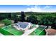 Aerial view of property featuring in-ground screened pool, mature landscaping, and large manicured lawn at 508 Starr Ridge Dr, Lake Wales, FL 33898