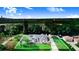 Aerial view of home with manicured lawn, outbuilding, a picturesque landscape, and surrounded by lush greenery at 508 Starr Ridge Dr, Lake Wales, FL 33898