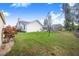 Large backyard features green grass, a screened-in pool, and an adjacent building at 508 Starr Ridge Dr, Lake Wales, FL 33898