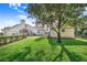 Large, grassy backyard featuring a shed and partial home view at 508 Starr Ridge Dr, Lake Wales, FL 33898