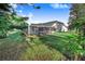 Beautiful backyard featuring a well-maintained lawn and screened-in pool area at 508 Starr Ridge Dr, Lake Wales, FL 33898