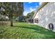 Lush backyard featuring an in-ground pool with screened enclosure, and green lawn at 508 Starr Ridge Dr, Lake Wales, FL 33898