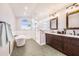 Beautiful bathroom featuring double sink vanity, soaking tub, and a separate glass shower at 508 Starr Ridge Dr, Lake Wales, FL 33898