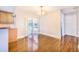 Bright dining area with sliding glass doors leading to a screened in pool and refinished wood floors at 508 Starr Ridge Dr, Lake Wales, FL 33898