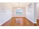 Bright dining room with hardwood floors, decorative chandelier, and large window at 508 Starr Ridge Dr, Lake Wales, FL 33898