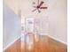 Bright and spacious foyer featuring refinished hardwood floors, arched doorway, and a white front door at 508 Starr Ridge Dr, Lake Wales, FL 33898
