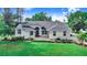 Stunning single-Gathering home featuring manicured lawn, mature trees, and a stately entrance at 508 Starr Ridge Dr, Lake Wales, FL 33898