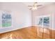 Sun-filled living room with hardwood floors, vaulted ceiling, and sliding glass doors to the pool area at 508 Starr Ridge Dr, Lake Wales, FL 33898