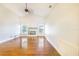 Spacious living room with fireplace, vaulted ceiling, and large windows at 508 Starr Ridge Dr, Lake Wales, FL 33898