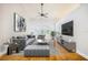 Nicely decorated living room with a grey sofa, hardwood floors and sliding glass doors to pool at 508 Starr Ridge Dr, Lake Wales, FL 33898