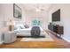 Comfortable main bedroom featuring hardwood floors, vaulted ceiling, and sliding glass doors at 508 Starr Ridge Dr, Lake Wales, FL 33898