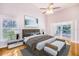 Cozy main bedroom boasts hardwood floors, a vaulted ceiling and sliding glass doors to the pool area at 508 Starr Ridge Dr, Lake Wales, FL 33898