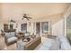 Covered brick patio, furnished with sitting area and dining set, with sliding glass doors to screened-in pool at 508 Starr Ridge Dr, Lake Wales, FL 33898