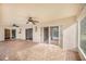 Covered brick patio with ceiling fans, with sliding glass doors leading to the screened-in pool area at 508 Starr Ridge Dr, Lake Wales, FL 33898
