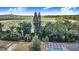 A view of the screened pool and the surrounding trees and farmland at 508 Starr Ridge Dr, Lake Wales, FL 33898