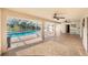 Large covered patio with brick flooring leading to a screened-in pool and backyard at 508 Starr Ridge Dr, Lake Wales, FL 33898
