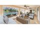 Large covered patio leading to a screened-in pool, with lounge and dining furniture for outdoor living at 508 Starr Ridge Dr, Lake Wales, FL 33898